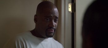 Movie still from “Chambers” (2019), created by Leah Rachel – A man with a beard is looking at the camera; Close Up shot, High angle