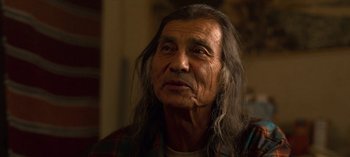 Movie still from “Chambers” (2019), created by Leah Rachel – An older man with long hair and a beard; Close Up shot, Over the shoulder angle