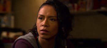 Movie still from “Chambers” (2019), created by Leah Rachel – A person wearing a sweater; Close Up shot, Over the shoulder angle