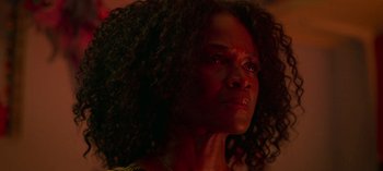 Movie still from “Chambers” (2019), created by Leah Rachel – A person with long curly hair; Close Up shot, Low angle