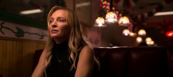 Movie still from “Chambers” (2019), created by Leah Rachel – A woman sitting in front of a christmas tree; Close Up shot, Over the shoulder angle