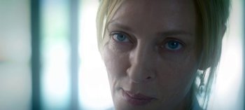 Movie still from “Chambers” (2019), created by Leah Rachel – A woman's face with blue eyes; Extreme Close Up shot, Overhead angle