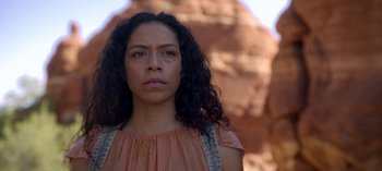 Movie still from “Chambers” (2019), created by Leah Rachel – A person with long curly black hair; Close Up shot, Low angle