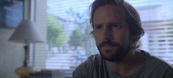 Movie still from “Chambers” (2019), created by Leah Rachel – A person with a beard; Close Up shot, Over the shoulder angle
