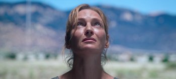 Movie still from “Chambers” (2019), created by Leah Rachel – A person looking up at the sky; Close Up shot, Low angle