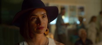 Movie still from “Chambers” (2019), created by Leah Rachel – A person wearing a hat; Close Up shot, Over the shoulder angle