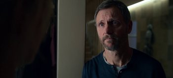 Movie still from “Chambers” (2019), created by Leah Rachel – A person looking at the camera; Close Up shot, Over the shoulder angle