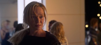 Movie still from “Chambers” (2019), created by Leah Rachel – A person wearing a black shirt; Close Up shot, Over the shoulder angle