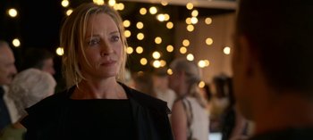 Movie still from “Chambers” (2019), created by Leah Rachel – A person wearing a black shirt; Close Up shot, Over the shoulder angle