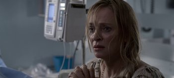 Movie still from “Chambers” (2019), created by Leah Rachel – A person with her hands clasped together; Close Up shot, High angle