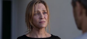 Movie still from “Chambers” (2019), created by Leah Rachel – A person wearing a black shirt; Close Up shot, Over the shoulder angle