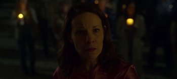 Movie still from “Chambers” (2019), created by Leah Rachel – A person wearing a red shirt; Close Up shot, Over the shoulder angle