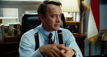Movie still from “Charlie Wilson's War” (2007), directed by Mike Nichols – Tom hanks in a scene from the movie forrest gump; Close Up shot, Over the shoulder angle