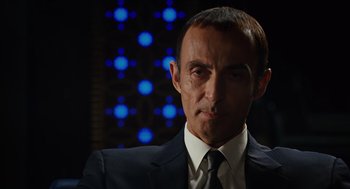 Movie still from “Charlie Wilson's War” (2007), directed by Mike Nichols – A person wearing a suit and tie; Close Up shot, Low angle