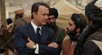 Movie still from “Charlie Wilson's War” (2007), directed by Mike Nichols – Tom hanks and shia labeouf in a scene from the movie ' indiana jones and the temple of doom '; Medium shot, Over the shoulder angle