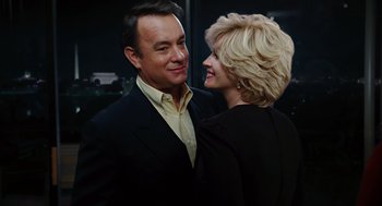 Movie still from “Charlie Wilson's War” (2007), directed by Mike Nichols – A man and a woman standing next to each other; Close Up shot, Low angle