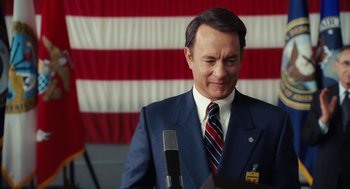 Movie still from “Charlie Wilson's War” (2007), directed by Mike Nichols – Tom hanks as president lyndon b; Medium shot, Low angle