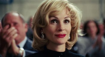 Movie still from “Charlie Wilson's War” (2007), directed by Mike Nichols – A person with blonde hair; Close Up shot, Low angle
