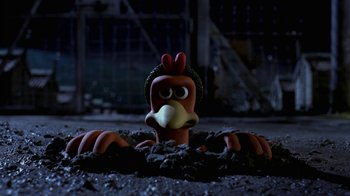 Movie still from “Chicken Run” (2000), directed by Peter Lord – A toy chicken in the middle of a pile of dirt; Close Up shot, High angle