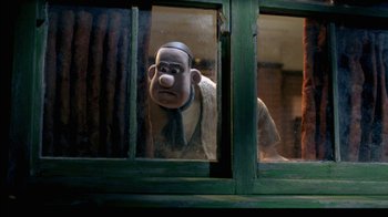 Movie still from “Chicken Run” (2000), directed by Peter Lord – A cartoon character looking out of a window; Medium shot, Over the shoulder angle