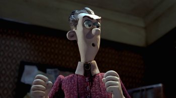 Movie still from “Chicken Run” (2000), directed by Peter Lord – A cartoon character's face and hands; Close Up shot, Low angle
