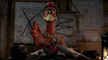Movie still from “Chicken Run” (2000), directed by Peter Lord – A turkey doll sitting on top of a table; Close Up shot, High angle