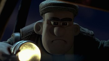 Movie still from “Chicken Run” (2000), directed by Peter Lord – A character's face in a movie; Close Up shot, Low angle