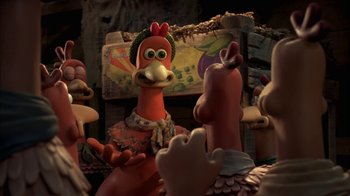 Movie still from “Chicken Run” (2000), directed by Peter Lord – A group of cartoon characters are gathered around a table; Close Up shot, Over the shoulder angle