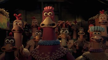 Movie still from “Chicken Run” (2000), directed by Peter Lord – A bunch of chickens that are standing in a room; Close Up shot, High angle