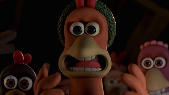 Movie still from “Chicken Run” (2000), directed by Peter Lord – The face of a toy chicken; Close Up shot, High angle