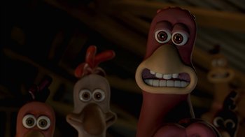 Movie still from “Chicken Run” (2000), directed by Peter Lord – View of a toy chicken and rooster; Close Up shot, Low angle