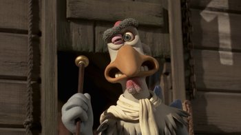 Movie still from “Chicken Run” (2000), directed by Peter Lord – A character holding a wooden stick; Close Up shot, Low angle