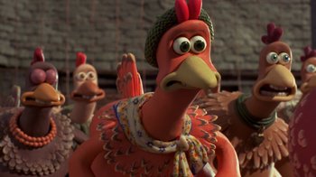 Movie still from “Chicken Run” (2000), directed by Peter Lord – A cartoon chicken wearing a green hat and holding a carrot; Close Up shot, High angle