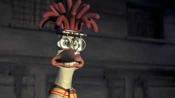 Movie still from “Chicken Run” (2000), directed by Peter Lord – A cartoon character with a red hair wig; Close Up shot, High angle
