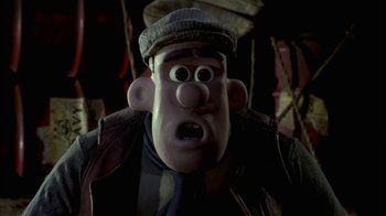 Movie still from “Chicken Run” (2000), directed by Peter Lord – A cartoon character wearing a hat; Close Up shot, Low angle
