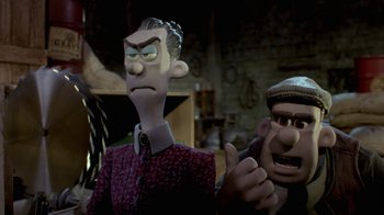 Movie still from “Chicken Run” (2000), directed by Peter Lord – Two cartoon characters are standing next to each other; Medium shot, Over the shoulder angle
