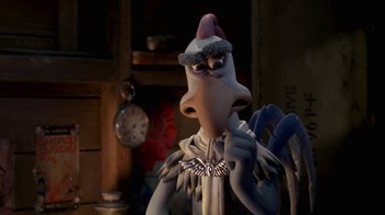 Movie still from “Chicken Run” (2000), directed by Peter Lord – A cartoon character is standing in front of a clock; Close Up shot, Over the shoulder angle