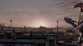 Movie still from “Chicken Run” (2000), directed by Peter Lord – A view of a sunset over a prison yard; Extreme Wide shot, Low angle