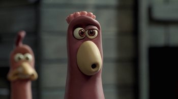 Movie still from “Chicken Run” (2000), directed by Peter Lord – The face of an animal figurine; Extreme Close Up shot, High angle