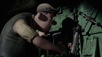 Movie still from “Chicken Run” (2000), directed by Peter Lord – A man in a hat and overalls working on a machine; Medium shot, Low angle