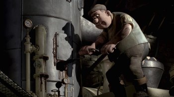 Movie still from “Chicken Run” (2000), directed by Peter Lord – An animated character is using a hammer to work on a machine; Medium shot, Low angle