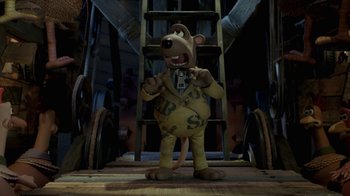 Movie still from “Chicken Run” (2000), directed by Peter Lord – A cartoon character is standing in front of a ladder; Wide shot, High angle