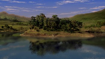 Movie still from “Chicken Run” (2000), directed by Peter Lord – An island in the middle of a lake surrounded by trees; Extreme Wide shot, High angle