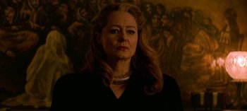 Movie still from “Chilling Adventures of Sabrina” (2018), created by Roberto Aguirre-Sacasa – A person with long hair; Close Up shot, Low angle