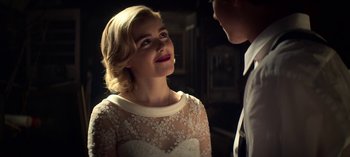 Movie still from “Chilling Adventures of Sabrina” (2018), created by Roberto Aguirre-Sacasa – A man and a woman talking to each other; Close Up shot, Over the shoulder angle