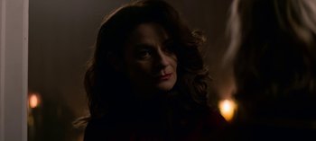 Movie still from “Chilling Adventures of Sabrina” (2018), created by Roberto Aguirre-Sacasa – A person with long dark hair; Close Up shot, Over the shoulder angle