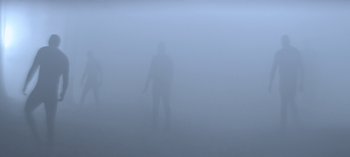 Movie still from “Chilling Adventures of Sabrina” (2018), created by Roberto Aguirre-Sacasa – Two people standing in the middle of a foggy field; Extreme Wide shot, Low angle