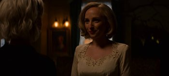Movie still from “Chilling Adventures of Sabrina” (2018), created by Roberto Aguirre-Sacasa – A woman with blonde hair wearing a white dress; Close Up shot, Over the shoulder angle