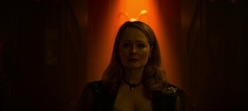 Movie still from “Chilling Adventures of Sabrina” (2018), created by Roberto Aguirre-Sacasa – A woman with long blonde hair wearing a black dress; Close Up shot, Low angle