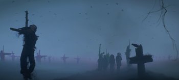 Movie still from “Chilling Adventures of Sabrina” (2018), created by Roberto Aguirre-Sacasa – A group of people standing on top of a hill; Extreme Wide shot, Low angle